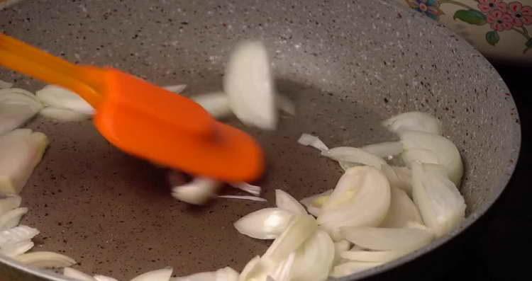 pour the chopped onion into the oil