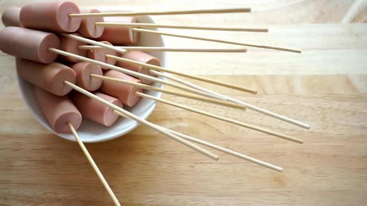 put sausages on skewers