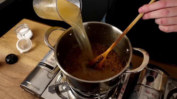 pour the broth into the onion