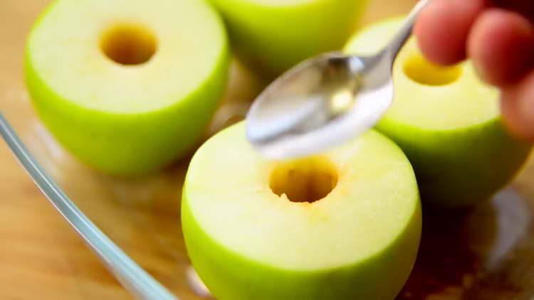 pour apples with brandy