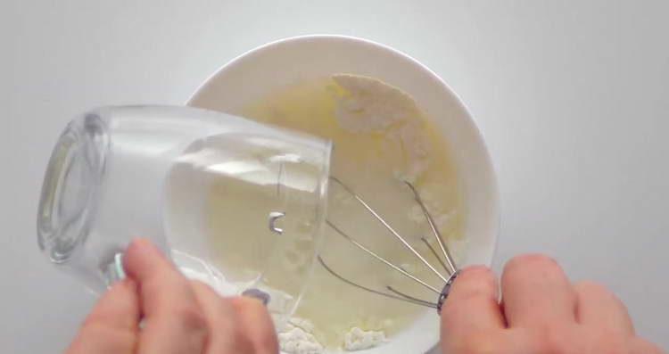 pour flour into the water