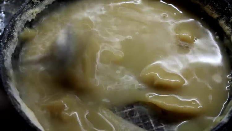 pour water into the flour