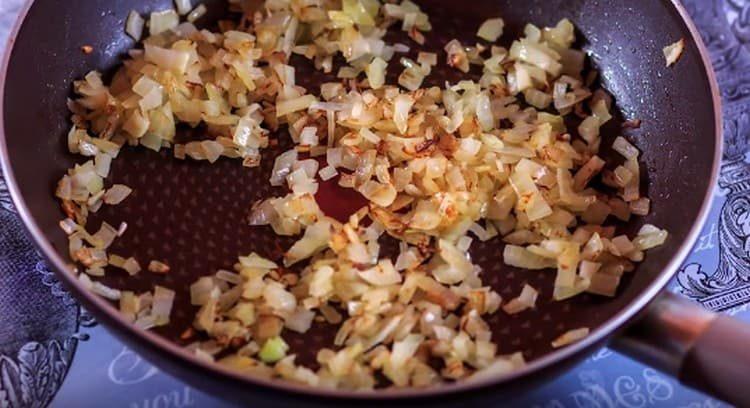 Grind onion and fry it in oil.