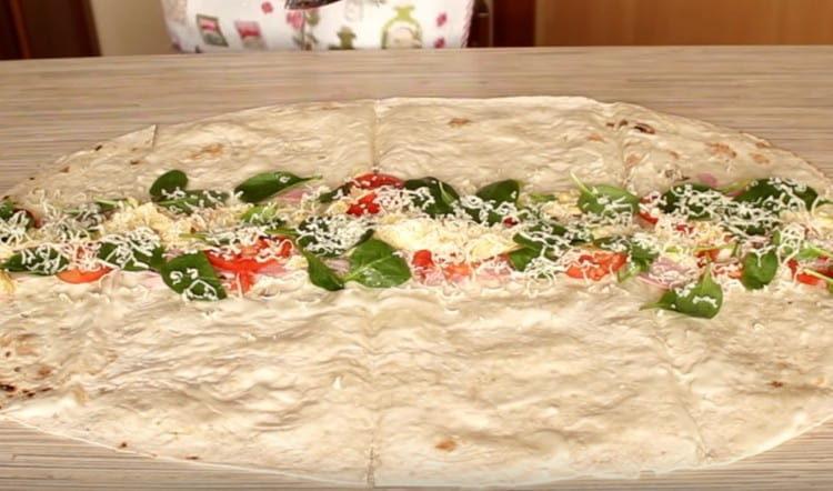 Rub some grated cheese on top of the filling.