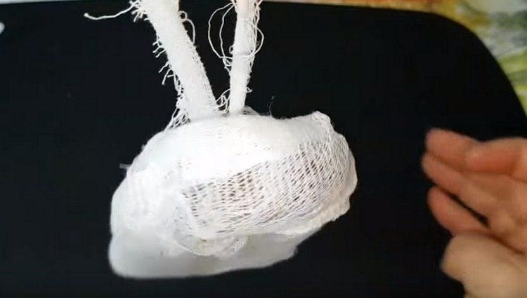 Each piece is wrapped in several layers of gauze and suspended to dry.