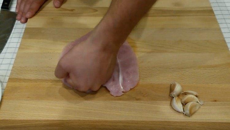 Press the meat with your fist.