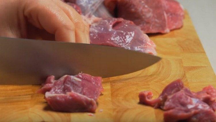 Cut the lamb into small pieces.