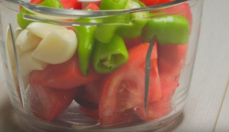 Add garlic and hot pepper to the tomatoes.