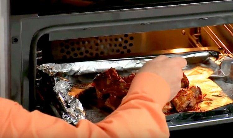 We bake the ribs in the oven, pouring them from time to time with sauce.