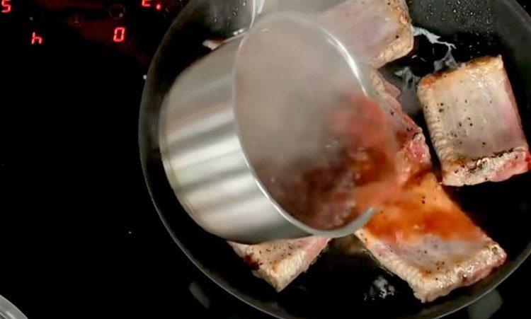 Add a little marinade to the ribs.