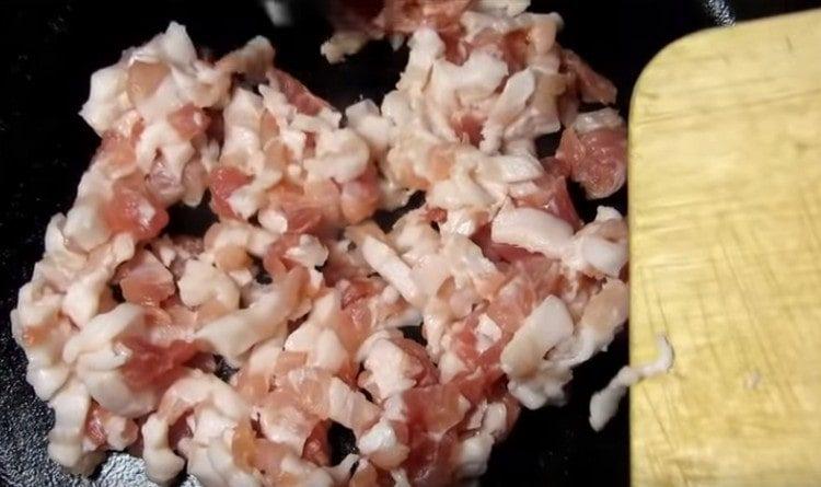 Finely chop the brisket and fry in a pan.