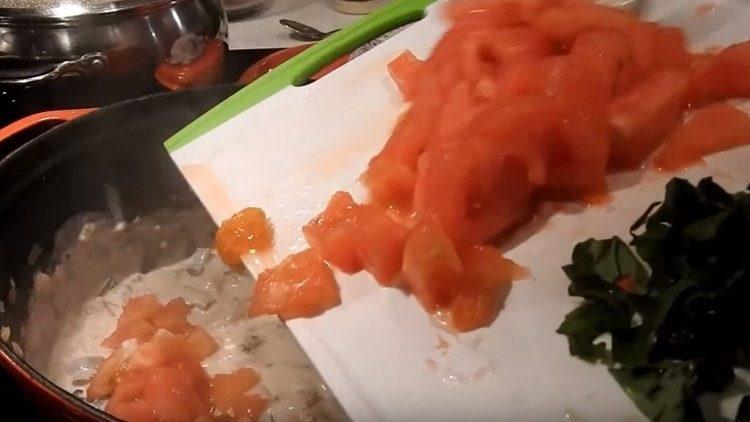 Add chopped tomatoes and basil to the pan.