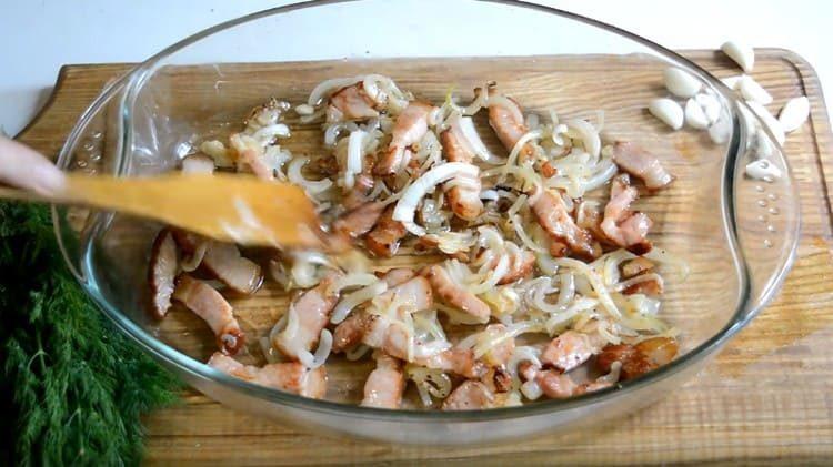 We shift the brisket with onions into a baking dish.