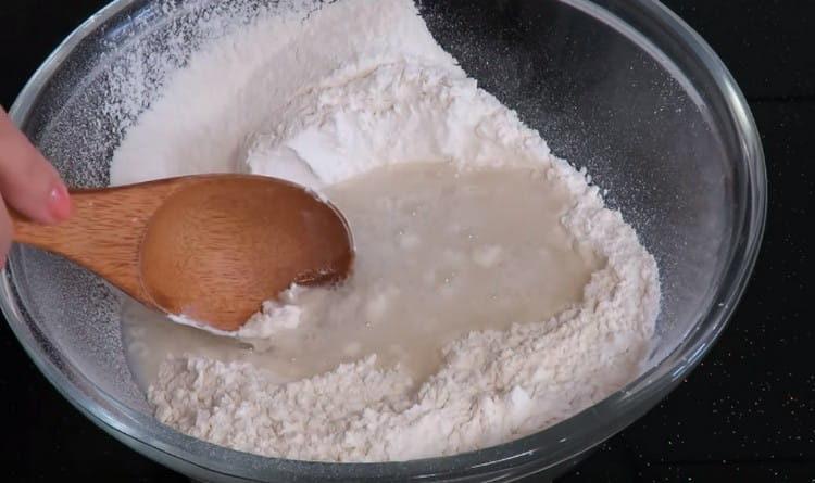 Pour boiling water with salt into flour.