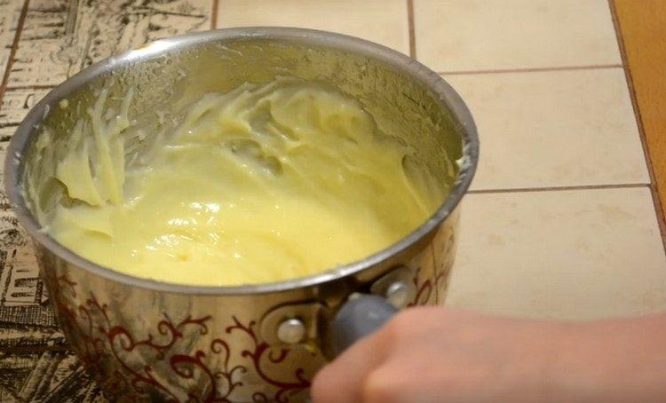 Add butter to the cooled cream and beat.