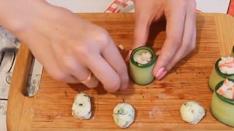 put crab sticks on top of each roll.