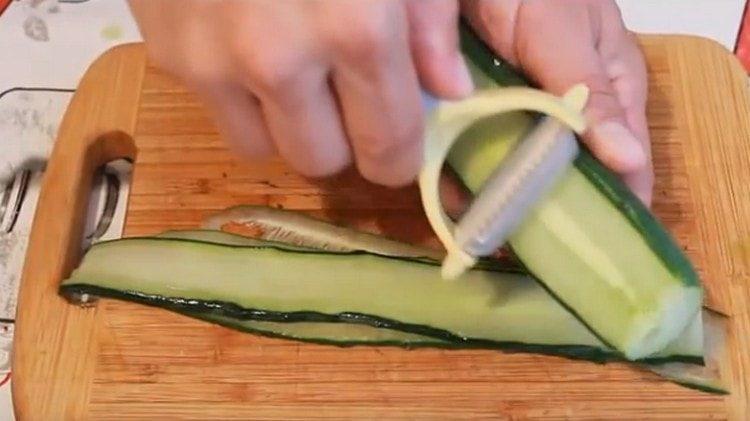 Peeler cut long cucumbers.