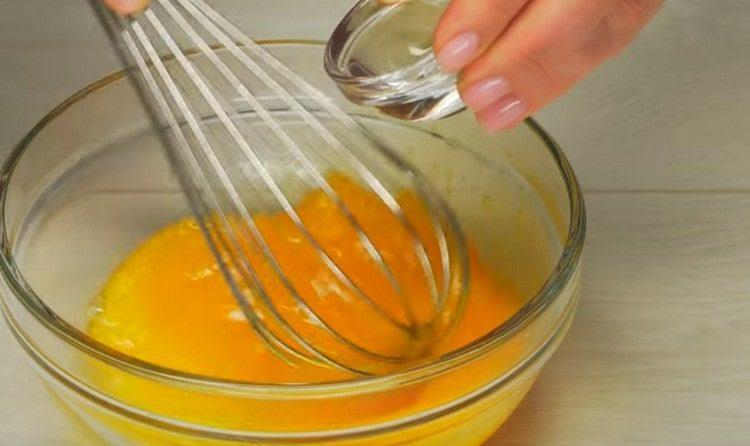 Stir the yolks and add water.