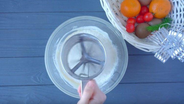 Sift the flour and knead the dough.