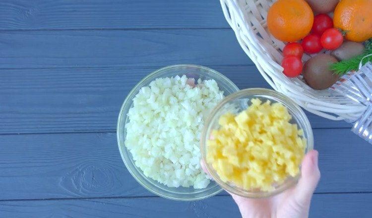 Add chopped onions and chopped potatoes to the chicken meat.