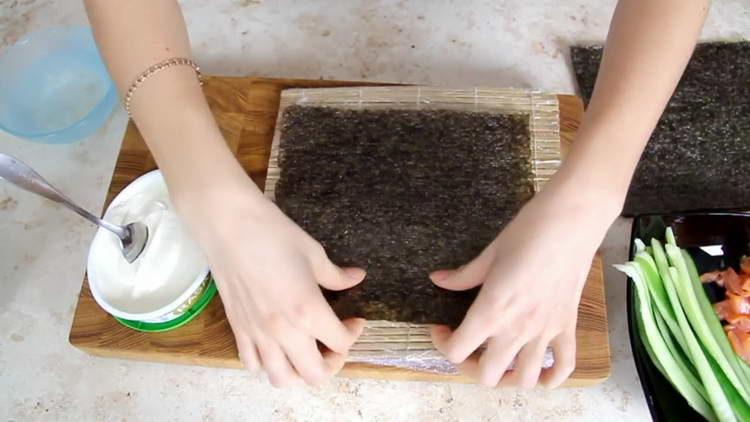 put the nori sheet on the mat