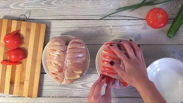 insert cheese and tomatoes into cuts