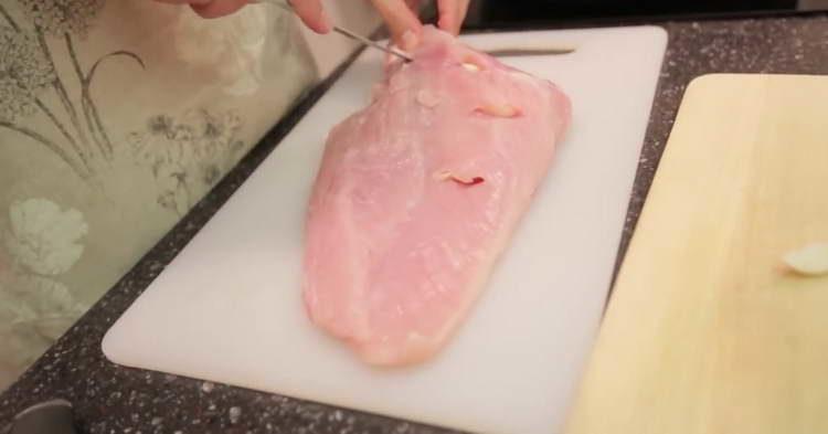 stick the garlic into cuts