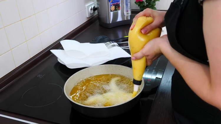 squeeze the dough into butter in a pan