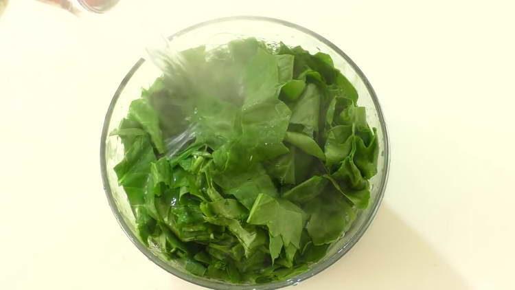 pour spinach with boiling water