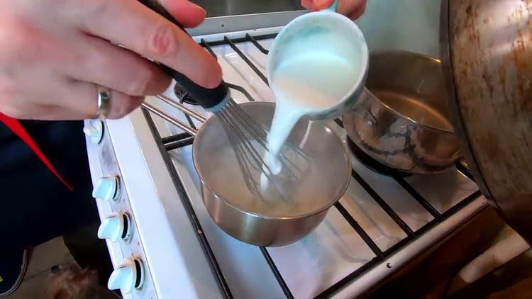 pour milk into flour