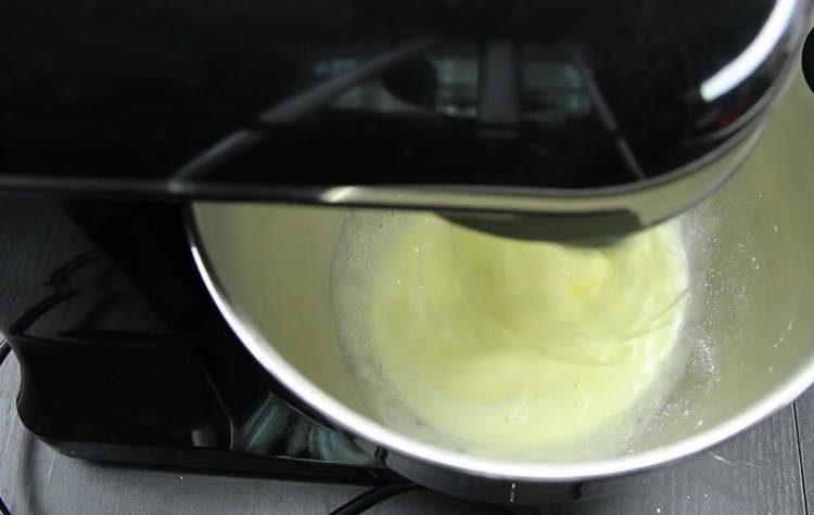 pour the milk into the dough with a thin stream